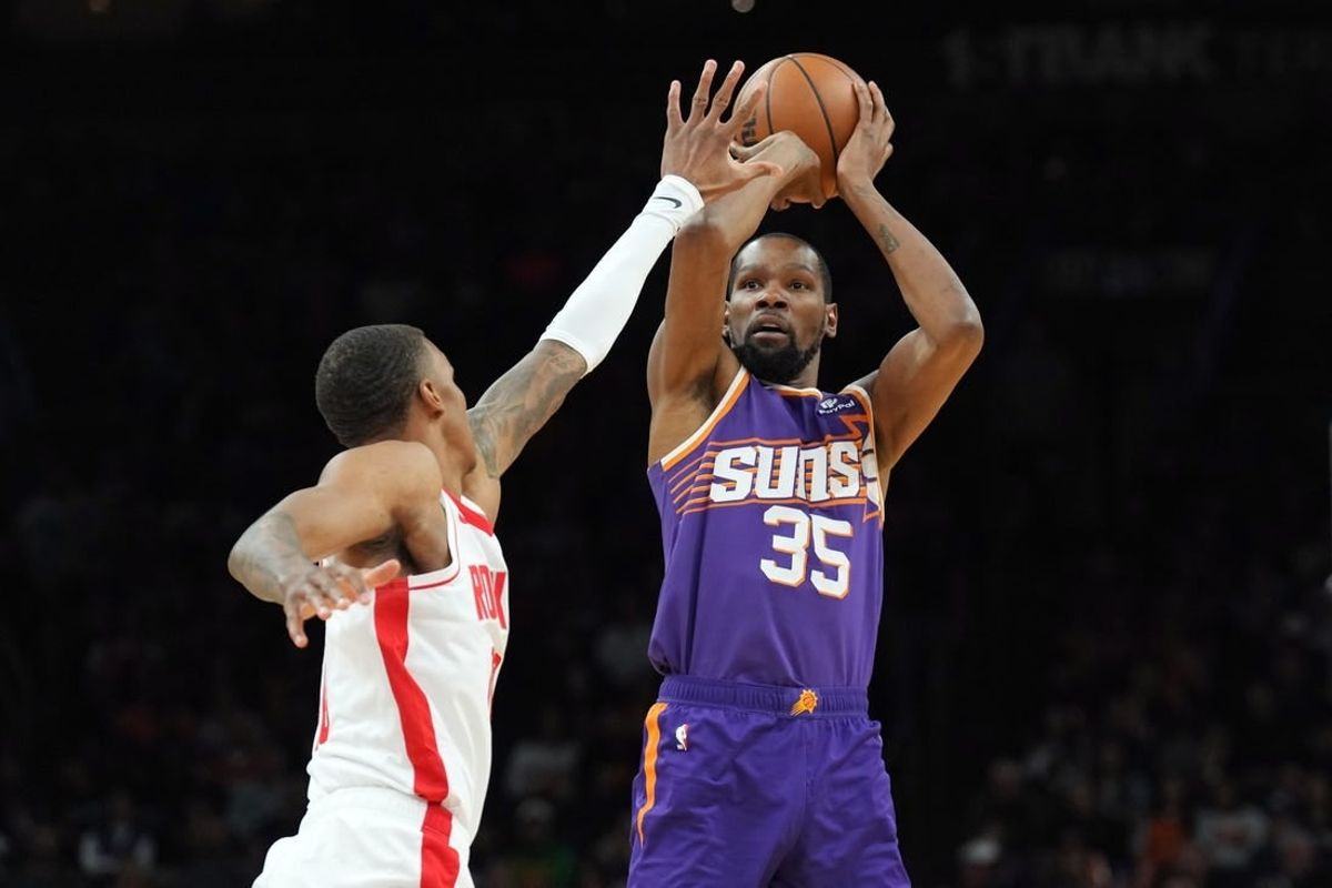Mar 2, 2024; Phoenix, Arizona, USA; Phoenix Suns forward Kevin Durant (35) shoots against the Houston Rockets during the second half at Footprint Center.