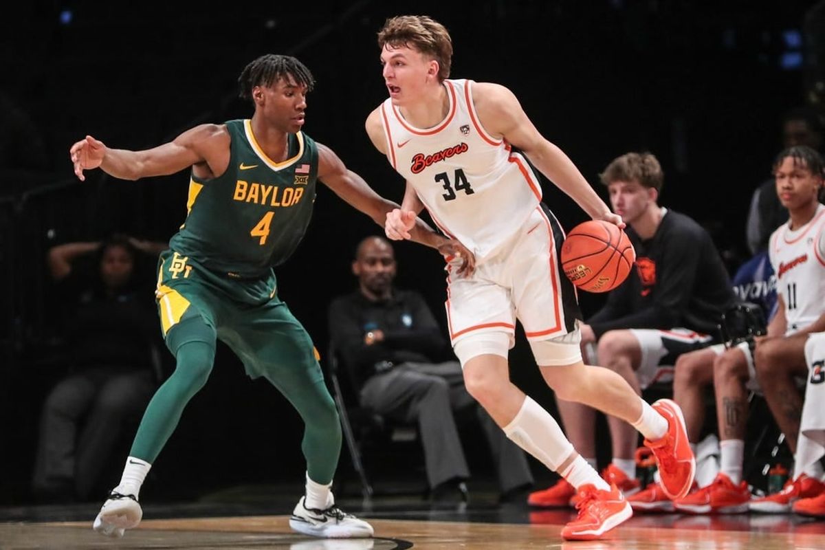 Nov 22, 2023; Brooklyn, NY, USA;  Oregon State Beavers forward Tyler Bilodeau (34) and Baylor Bears guard Ja'Kobe Walter (4) at Barclay Center.