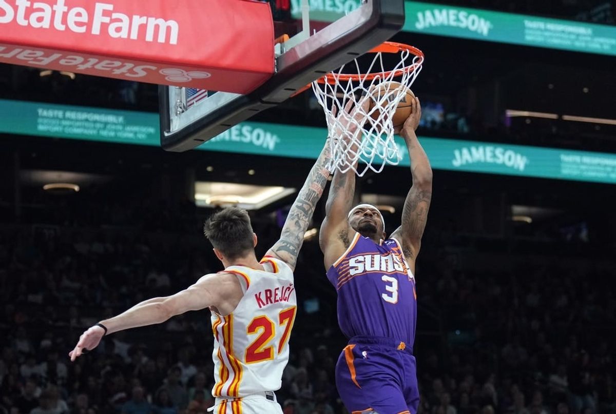 Mar 21, 2024; Phoenix, Arizona, USA; Phoenix Suns guard Bradley Beal (3) dunks over Atlanta Hawks guard Vit Krejci (27) during the first half at Footprint Center.