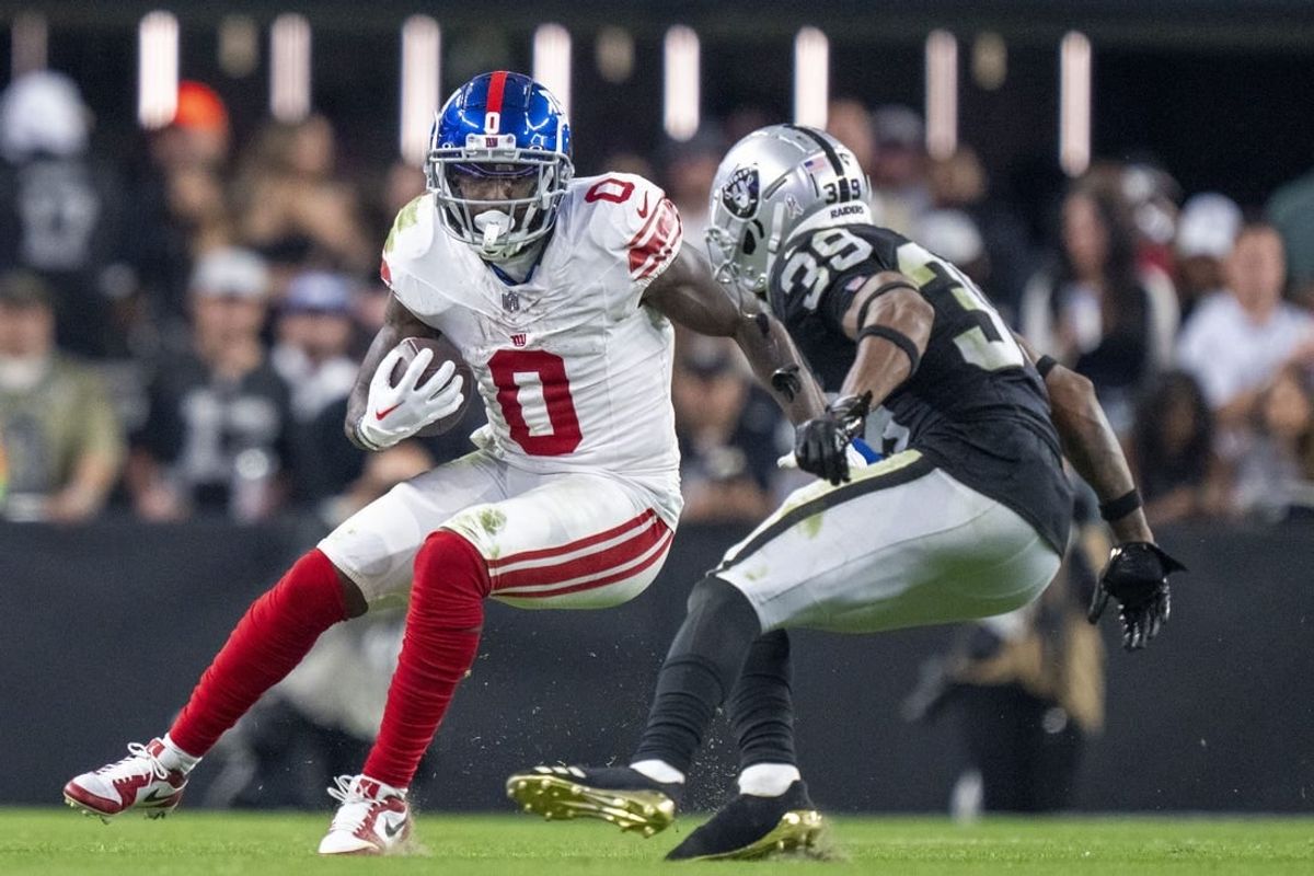 November 5, 2023; Paradise, Nevada, USA; New York Giants wide receiver Parris Campbell (0) runs the football against Las Vegas Raiders cornerback Nate Hobbs (39) during the fourth quarter at Allegiant Stadium.