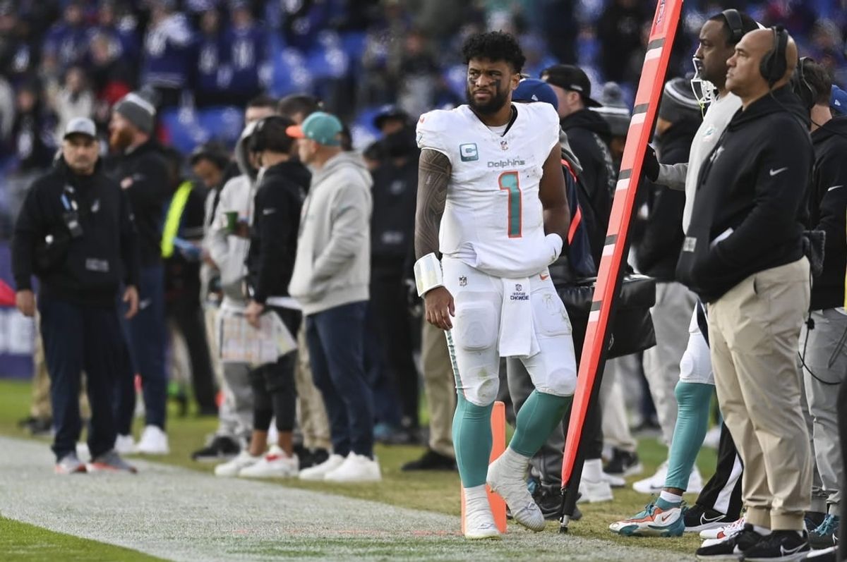 Dec 31, 2023; Baltimore, Maryland, USA;  Miami Dolphins quarterback Tua Tagovailoa (1) walks down the sidelines during the second half against the Baltimore Ravens at M&T Bank Stadium.Baltimore Ravens defeated Miami Dolphins 56-19.