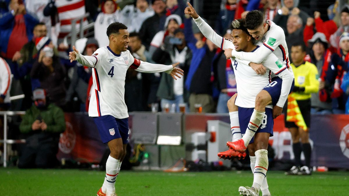Wes McKennie of the United States is congratulated by Christian Pulisic and Tyler Adams after scoring a goal during the second half of the FIFA World Cup 2022 Qualifier match against Mexico.
