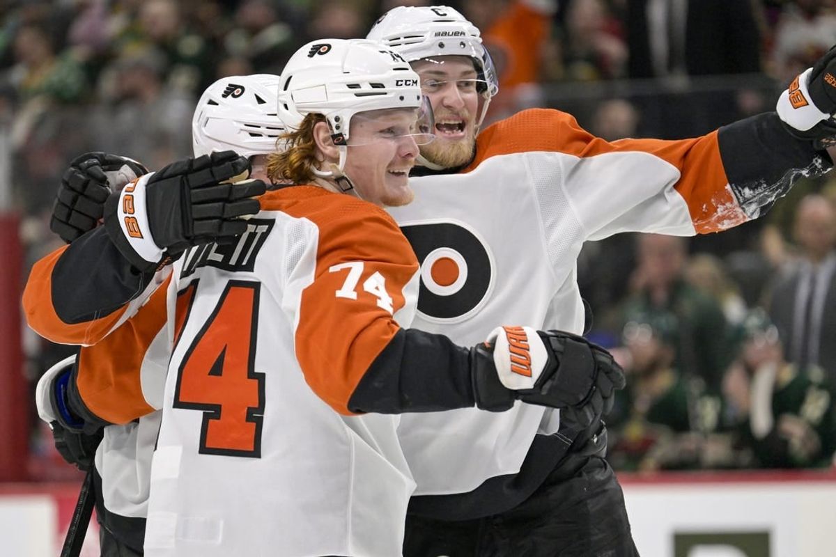 Jan 12, 2024; Saint Paul, Minnesota, USA; Philadelphia Flyers forward Owen Tippett (74) celebrates his goal against the Minnesota Wild during the third period with defenseman Travis Sanheim (6) at Xcel Energy Center.