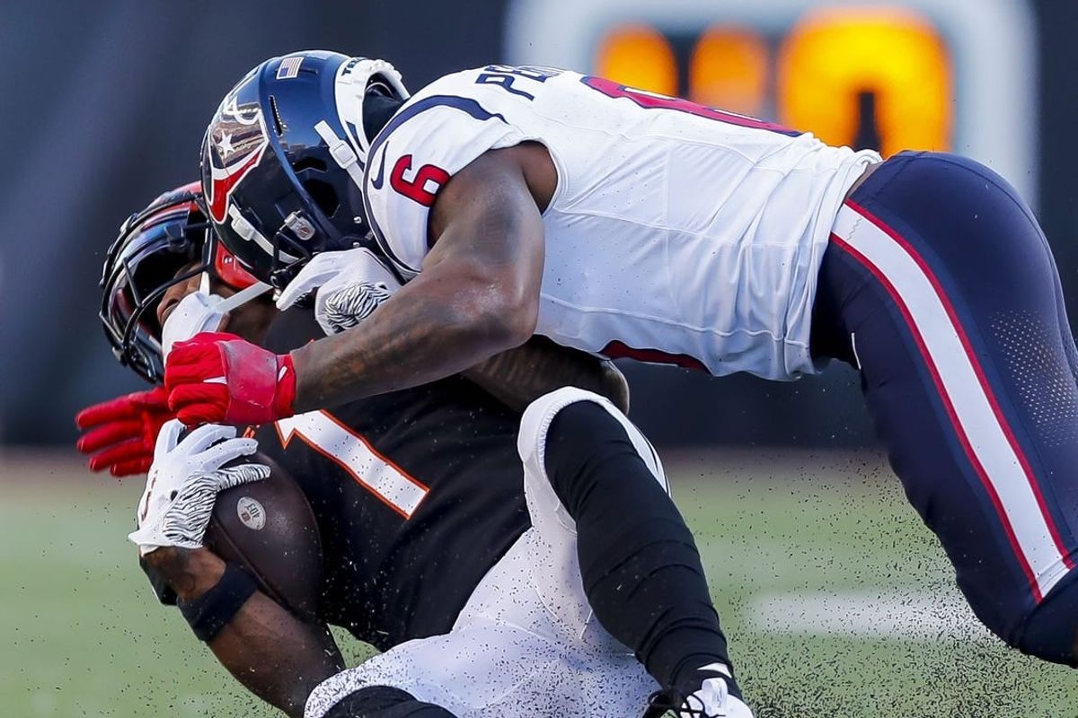 Nov 12, 2023; Cincinnati, Ohio, USA; Cincinnati Bengals wide receiver Ja'Marr Chase (1) collides with Houston Texans linebacker Denzel Perryman (6) in the second half at Paycor Stadium.