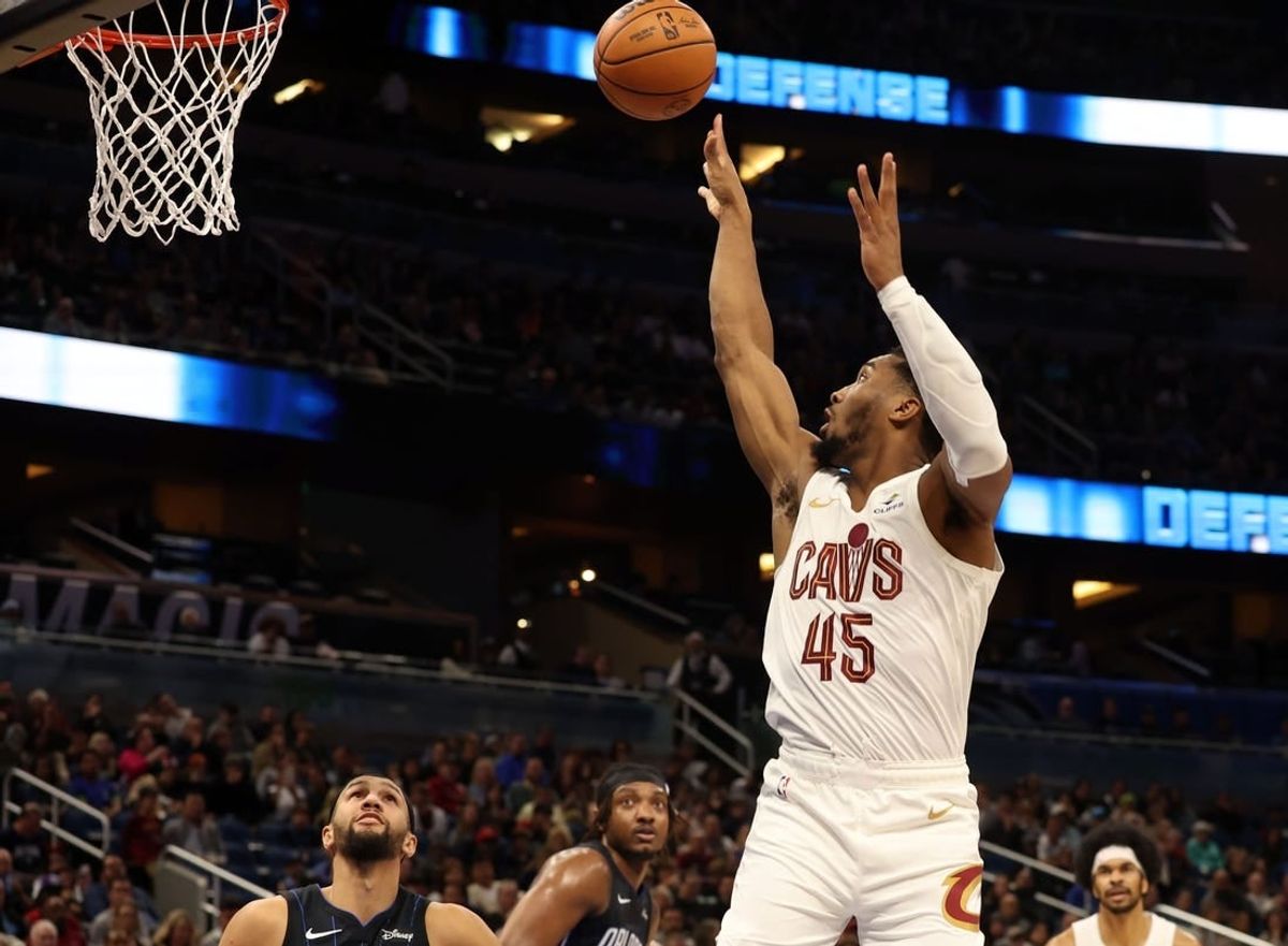 Jan 22, 2024; Orlando, Florida, USA; Cleveland Cavaliers guard Donovan Mitchell (45) makes a jump shot against the Orlando Magic during the second quarter at Kia Center.