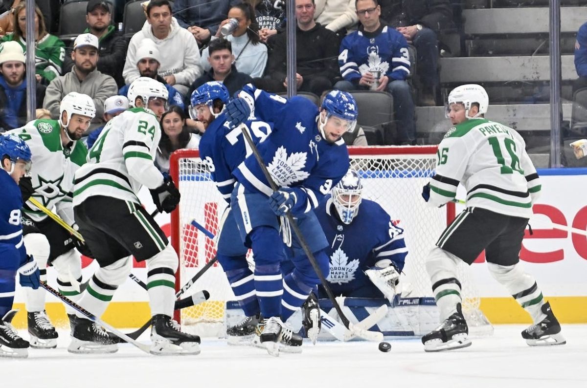 Feb 7, 2024; Toronto, Ontario, CAN; Toronto Maple Leafs forward Auston Matthews (34) clears the puck away from goalie Ilya Samsonov (35) as Dallas Stars forwards Joe Pavelski (16) and Roope Hintz (24) look on in the third period at Scotiabank Arena.