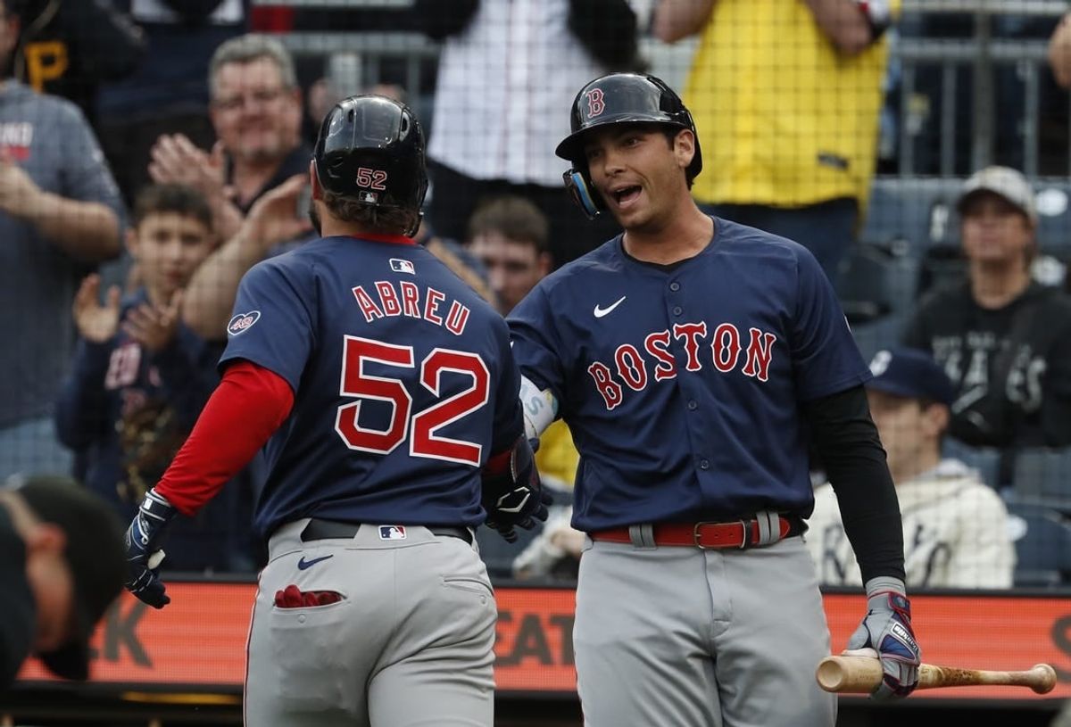 Apr 19, 2024; Pittsburgh, Pennsylvania, USA;  Boston Red Sox first baseman Triston Casas (right) greets left fielder Wilyer Abreu (52) crossing home plate on a solo home run against the Pittsburgh Pirates during the first inning at PNC Park.
