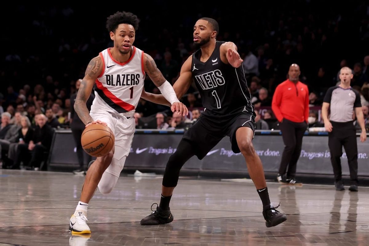 Jan 7, 2024; Brooklyn, New York, USA; Portland Trail Blazers guard Anfernee Simons (1) drives to the basket against Brooklyn Nets forward Mikal Bridges (1) during the first quarter at Barclays Center.