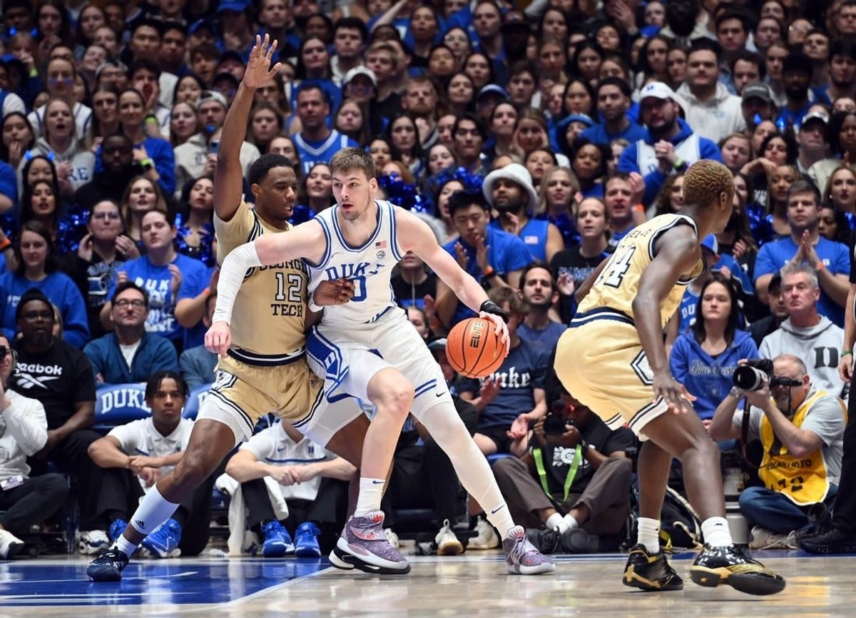 Jan 13, 2024; Durham, North Carolina, USA;  Duke Blue Devils center Kyle Filipowski (30) controls the ball against Georgia Tech Yellow Jackets foward Tyzhaun Claude (12)during the first half at Cameron Indoor Stadium.