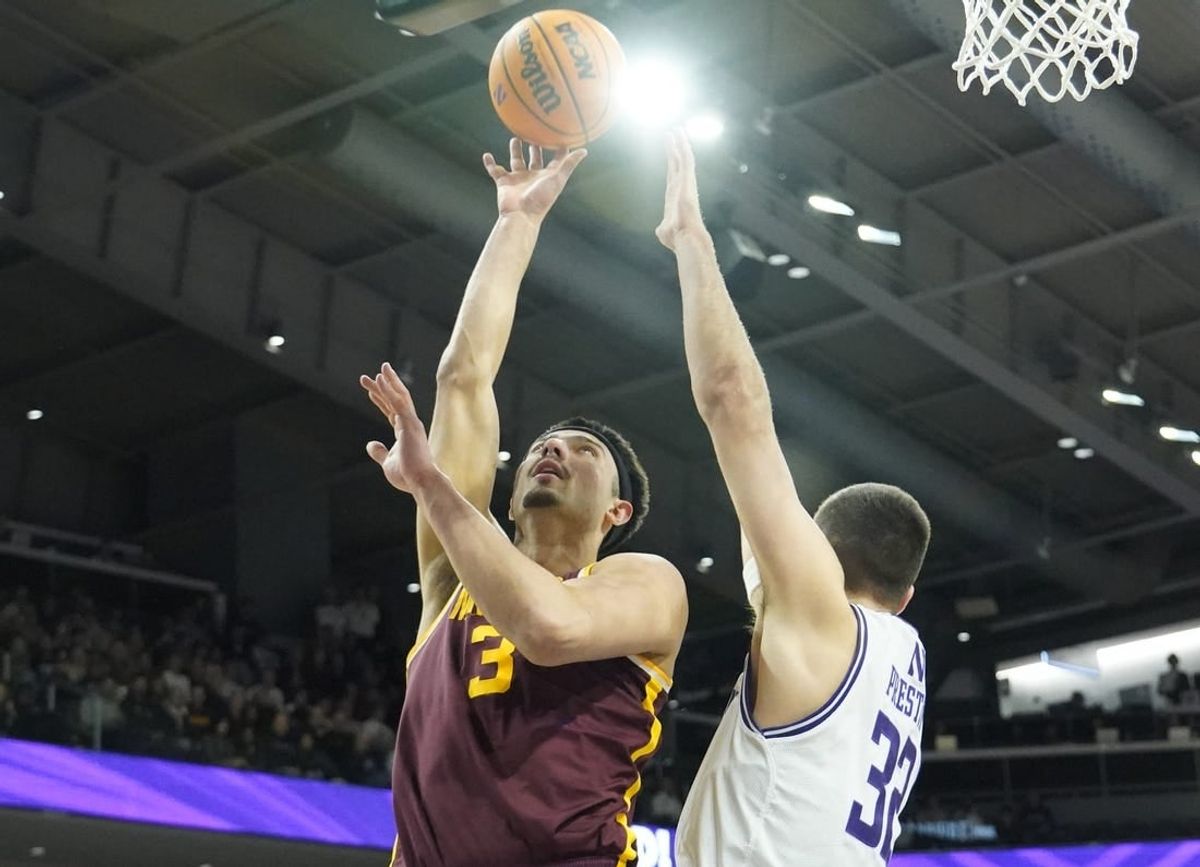 Mar 9, 2024; Evanston, Illinois, USA; Northwestern Wildcats forward Blake Preston (32) defends Minnesota Golden Gophers forward Dawson Garcia (3) during the first half at Welsh-Ryan Arena.