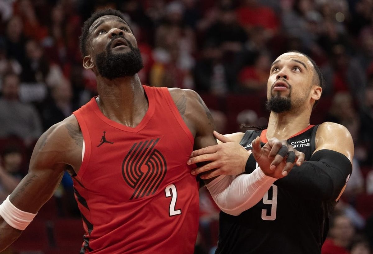 Jan 24, 2024; Houston, Texas, USA; Portland Trail Blazers center Deandre Ayton (2) tries to box out Houston Rockets forward Dillon Brooks (9) in the second quarter at Toyota Center.
