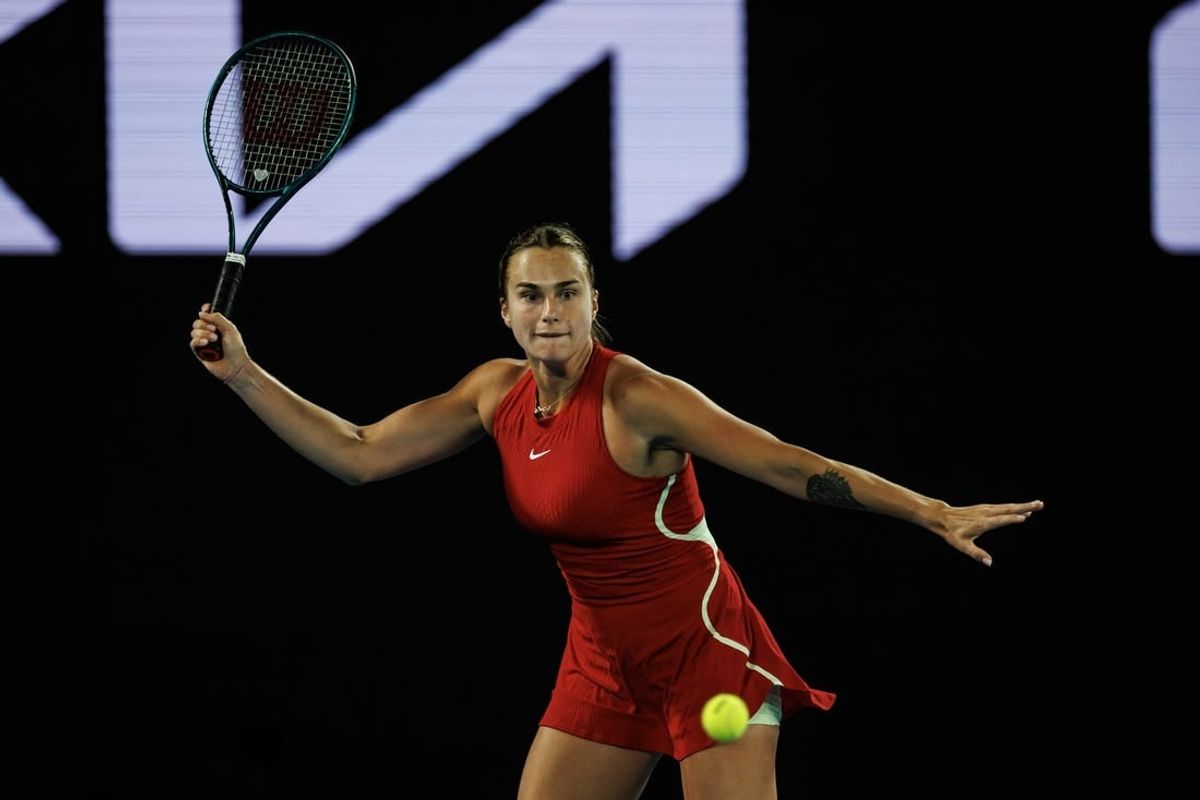 Jan 14, 2024; Melbourne, Victoria, Australia;  Aryna Sabalenka of Russia hits a shot against Ella Seidel of Germany in the first round of the women s singles.