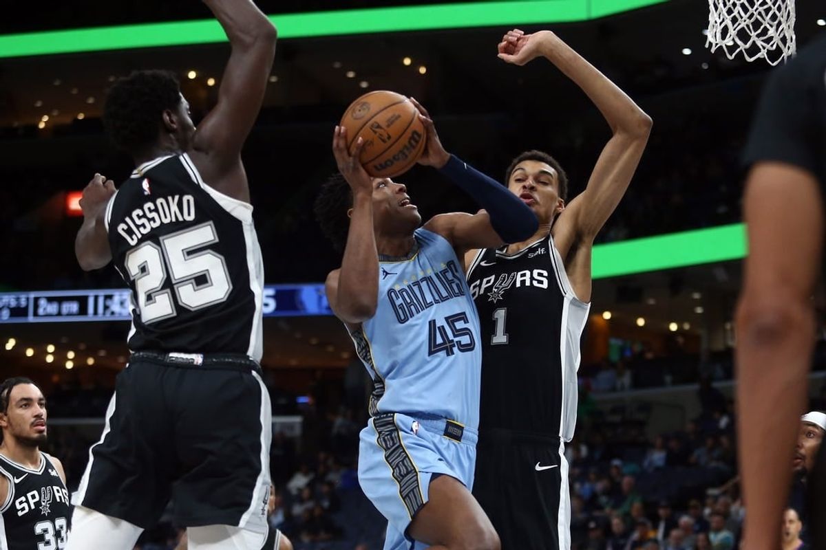 Apr 9, 2024; Memphis, Tennessee, USA; Memphis Grizzlies forward GG Jackson (45) drives to the basket between San Antonio Spurs guard Sidy Cissoko (25) and center Victor Wembanyama (1) during the first half at FedExForum.