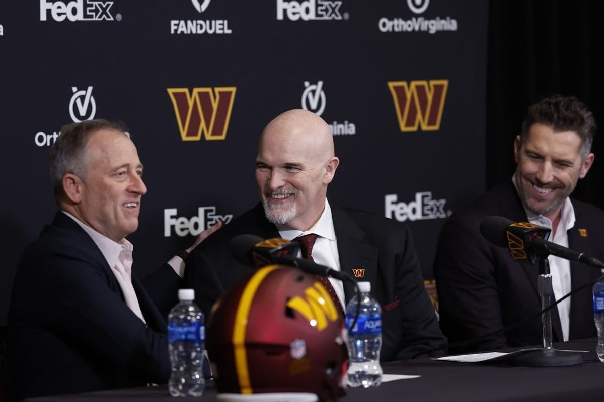 Commanders majority owner Josh Harris (L), head coach Dan Quinn (M) and general manager Adam Peters are embracing the "pressure" to get the No. 2 pick right.