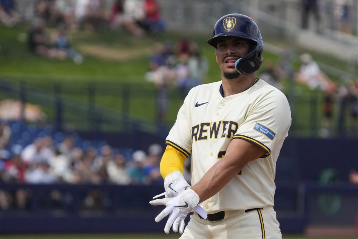 Mar 18, 2024; Phoenix, Arizona, USA; Milwaukee Brewers shortstop Willy Adames (27) reacts after hitting a single against the Los Angeles Angels in the second inning at American Family Fields of Phoenix.