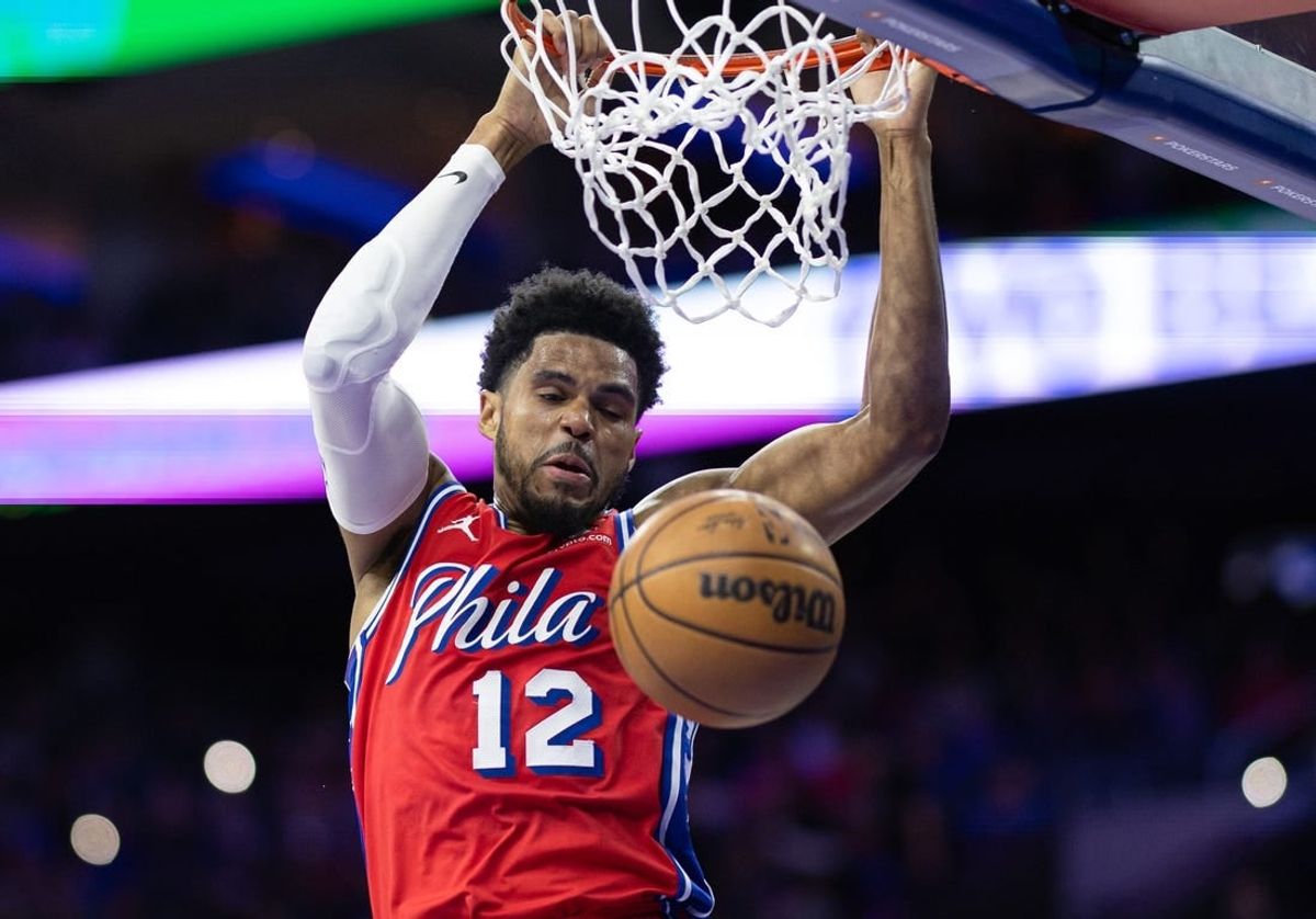 Mar 1, 2024; Philadelphia, Pennsylvania, USA; Philadelphia 76ers forward Tobias Harris (12) dunks the ball against the Charlotte Hornets during the second quarter at Wells Fargo Center.