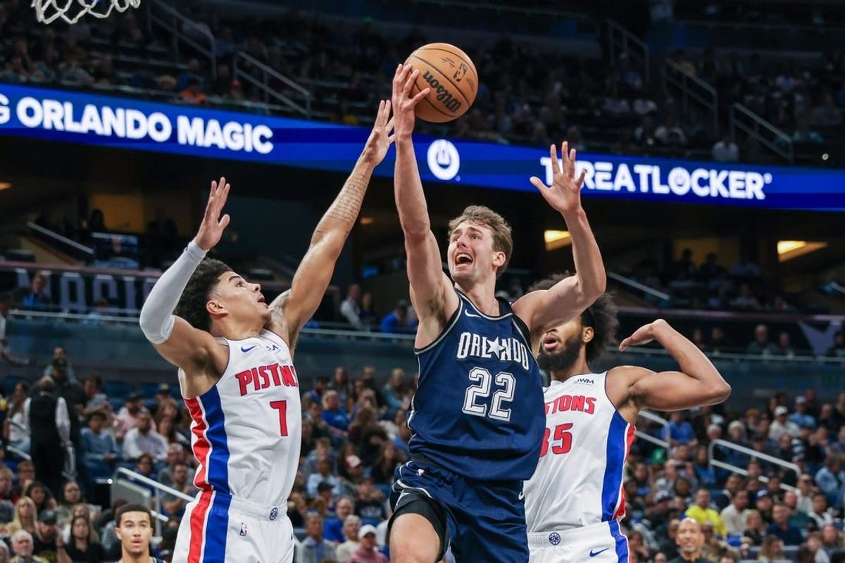 Dec 8, 2023; Orlando, Florida, USA; Orlando Magic forward Franz Wagner (22) goes to the basket against Detroit Pistons guard Killian Hayes (7) during the second quarter at Amway Center.