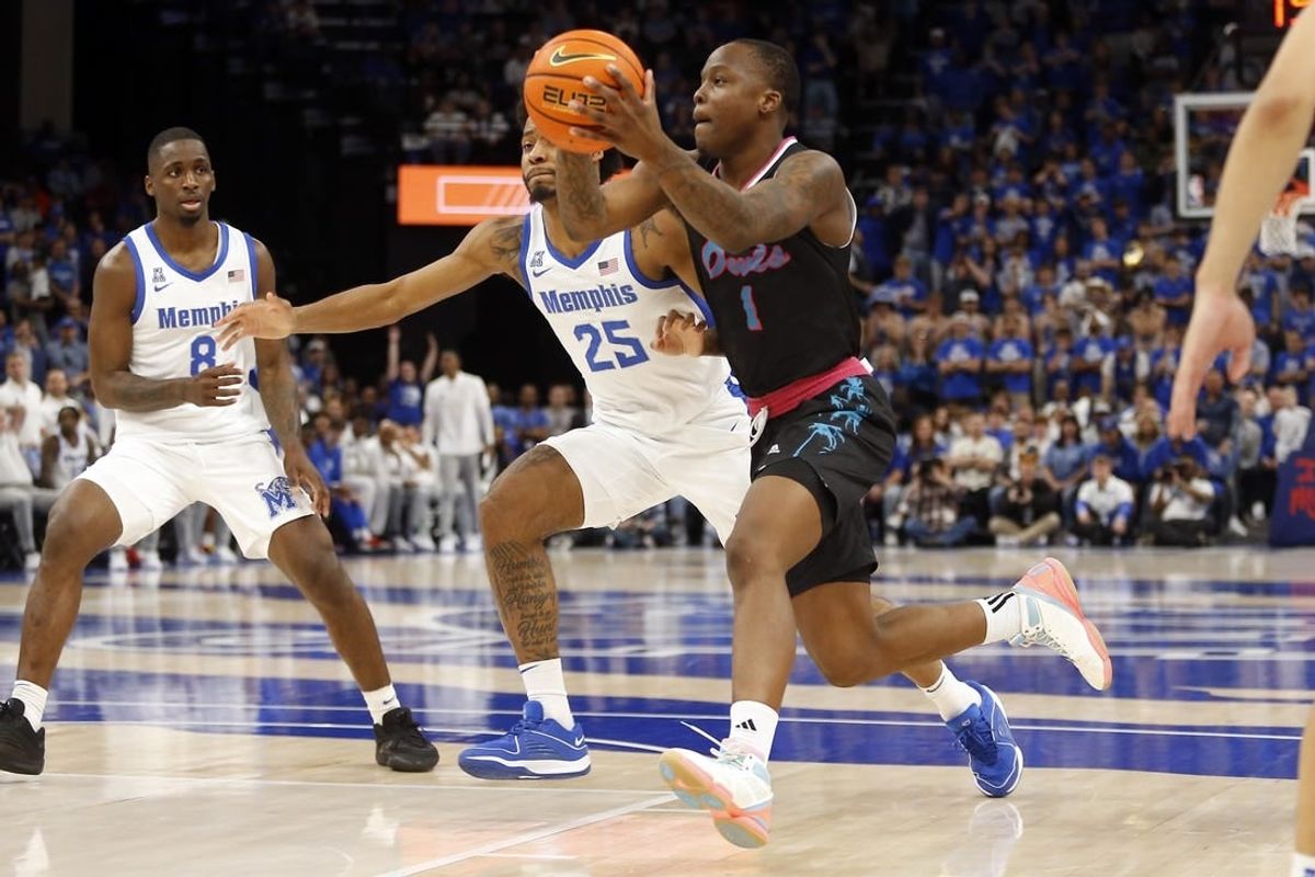 Feb 25, 2024; Memphis, Tennessee, USA; Florida Atlantic Owls guard Johnell Davis (1) drives to the basket as Memphis Tigers guard Jayden Hardaway (25) defends during the second half at FedExForum.