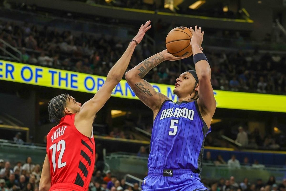 Apr 1, 2024; Orlando, Florida, USA; Orlando Magic forward Paolo Banchero (5) shoots the ball against Portland Trail Blazers guard Rayan Rupert (72) during the second half at Amway Center.