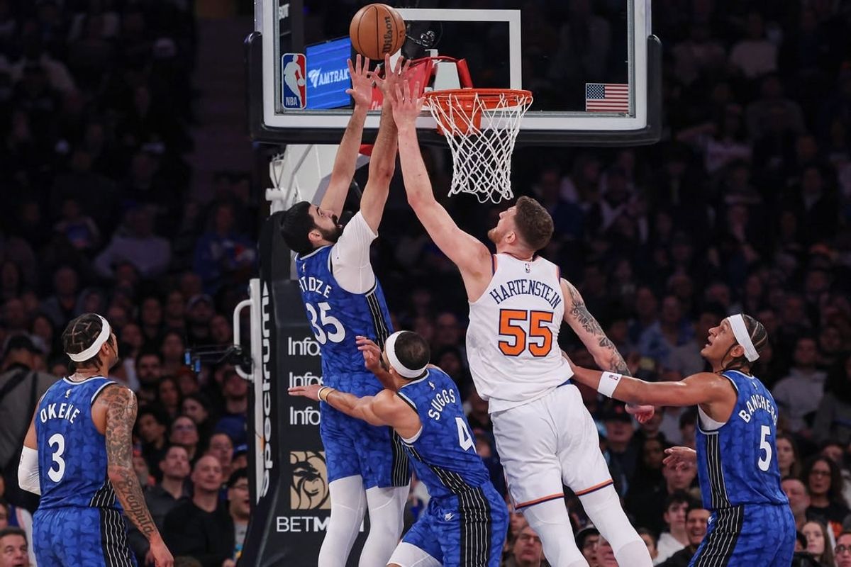 Jan 15, 2024; New York, New York, USA; Orlando Magic center Goga Bitadze (35) rebounds against New York Knicks center Isaiah Hartenstein (55) during the first half at Madison Square Garden.