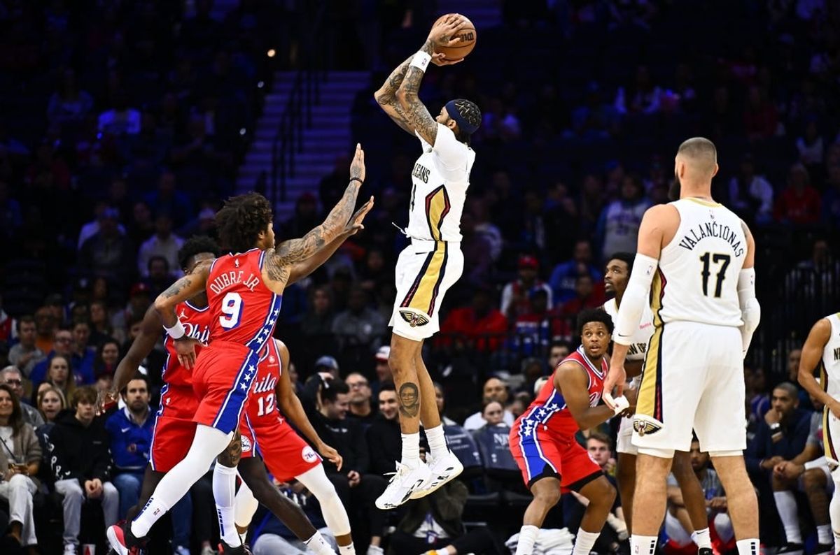 Mar 8, 2024; Philadelphia, Pennsylvania, USA; New Orleans Pelicans forward Brandon Ingram (14) shoots over Philadelphia 76ers guard Kelly Oubre Jr (9) in the first quarter at Wells Fargo Center.