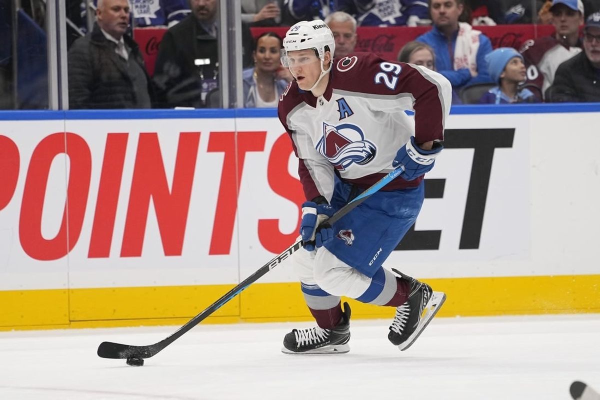Jan 13, 2024; Toronto, Ontario, CAN; Colorado Avalanche forward Nathan MacKinnon (29)  carries the puck against the Toronto Maple Leafs during the second period at Scotiabank Arena.