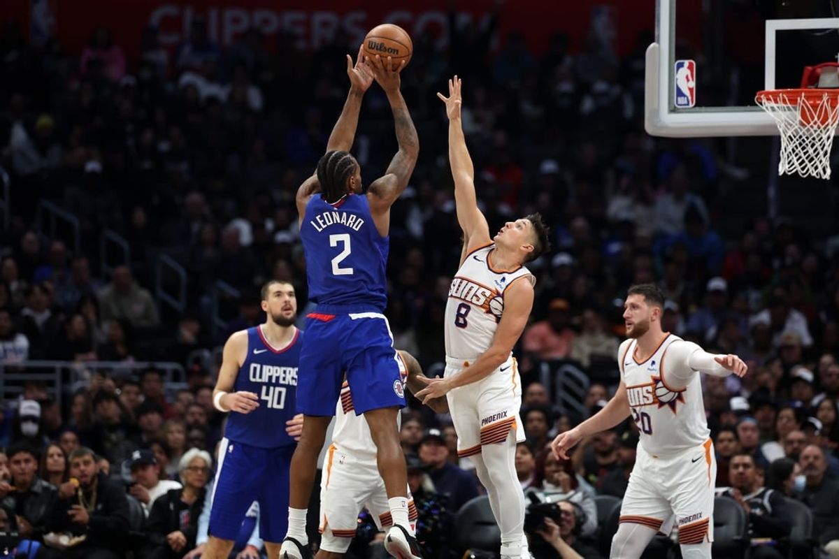 Jan 8, 2024; Los Angeles, California, USA;  Los Angeles Clippers forward Kawhi Leonard (2) shoots the ball over Phoenix Suns guard Grayson Allen (8) during the second half at Crypto.com Arena.