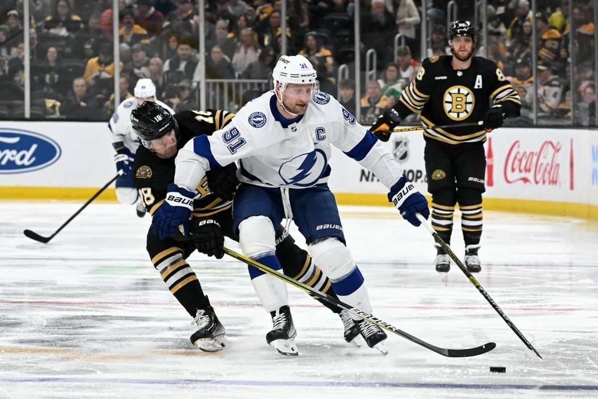 Jan 6, 2024; Boston, Massachusetts, USA; Tampa Bay Lightning center Steven Stamkos (91) controls the puck against Boston Bruins center Pavel Zacha (18) during the second period at the TD Garden.