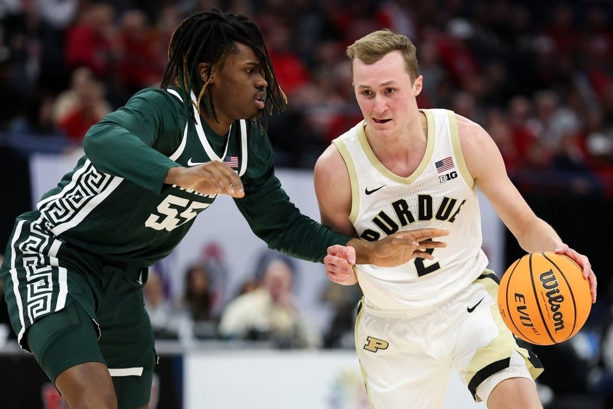 Mar 15, 2024; Minneapolis, MN, USA; Purdue Boilermakers guard Fletcher Loyer (2) works around Michigan State Spartans forward Coen Carr (55) during the first half at Target Center.