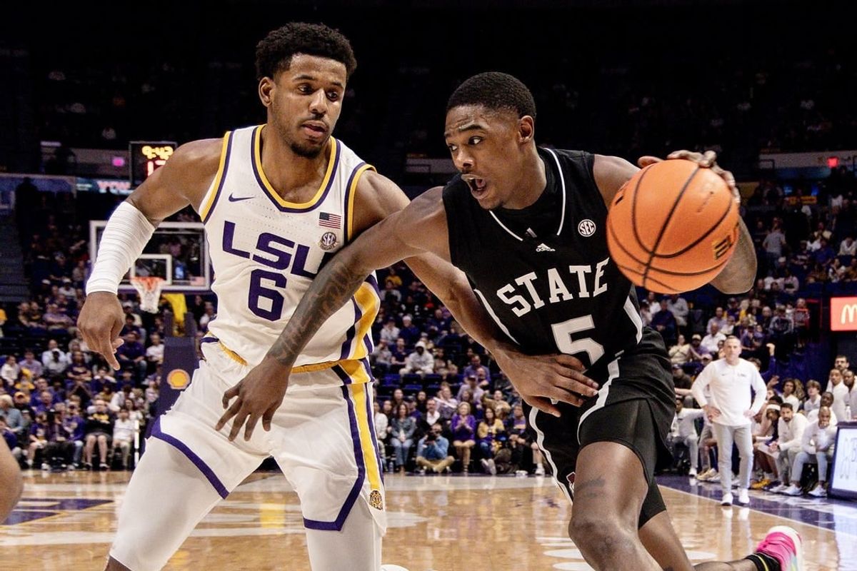 Feb 24, 2024; Baton Rouge, Louisiana, USA; Mississippi State Bulldogs guard Shawn Jones Jr. (5) drives to the basket against LSU Tigers guard Jordan Wright (6) during the second half at Pete Maravich Assembly Center.