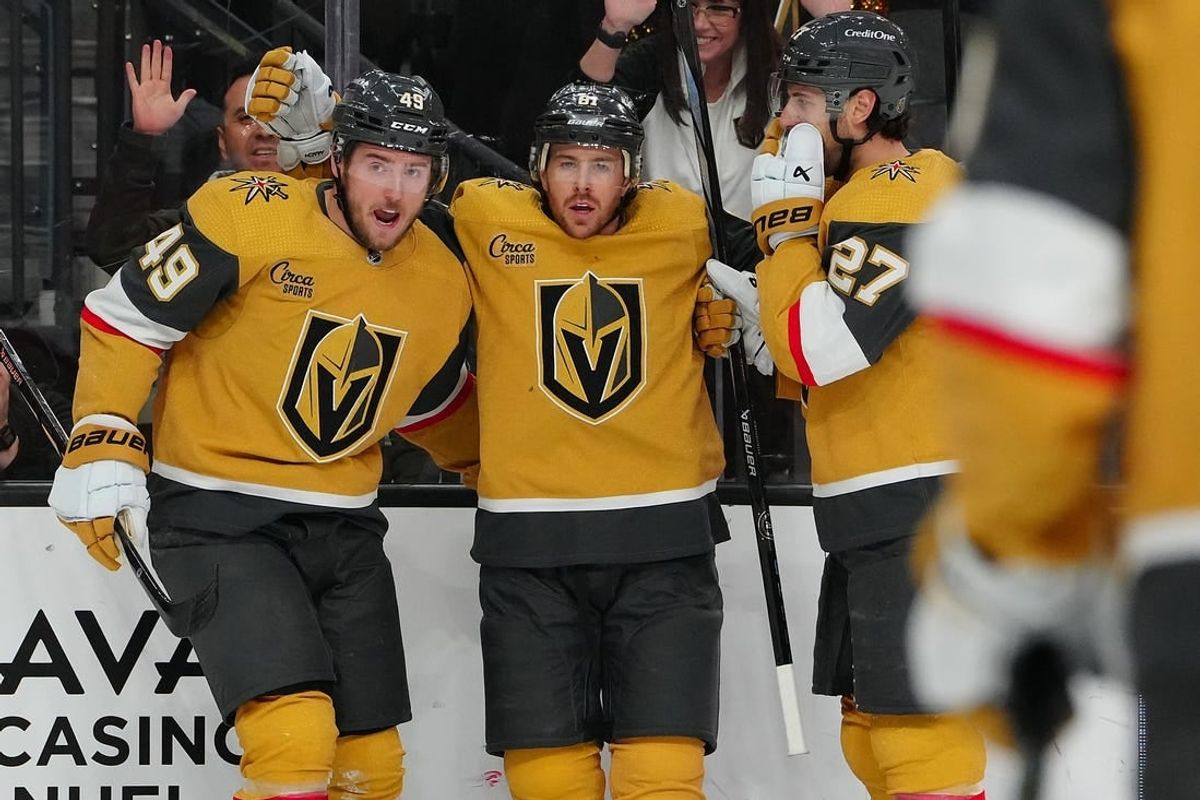 Apr 2, 2024; Las Vegas, Nevada, USA; Vegas Golden Knights right wing Jonathan Marchessault (81) celebrates with Vegas Golden Knights center Ivan Barbashev (49) and Vegas Golden Knights defenseman Shea Theodore (27) after scoring a goal against the Vancouver Canucks during the first period at T-Mobile Arena.
