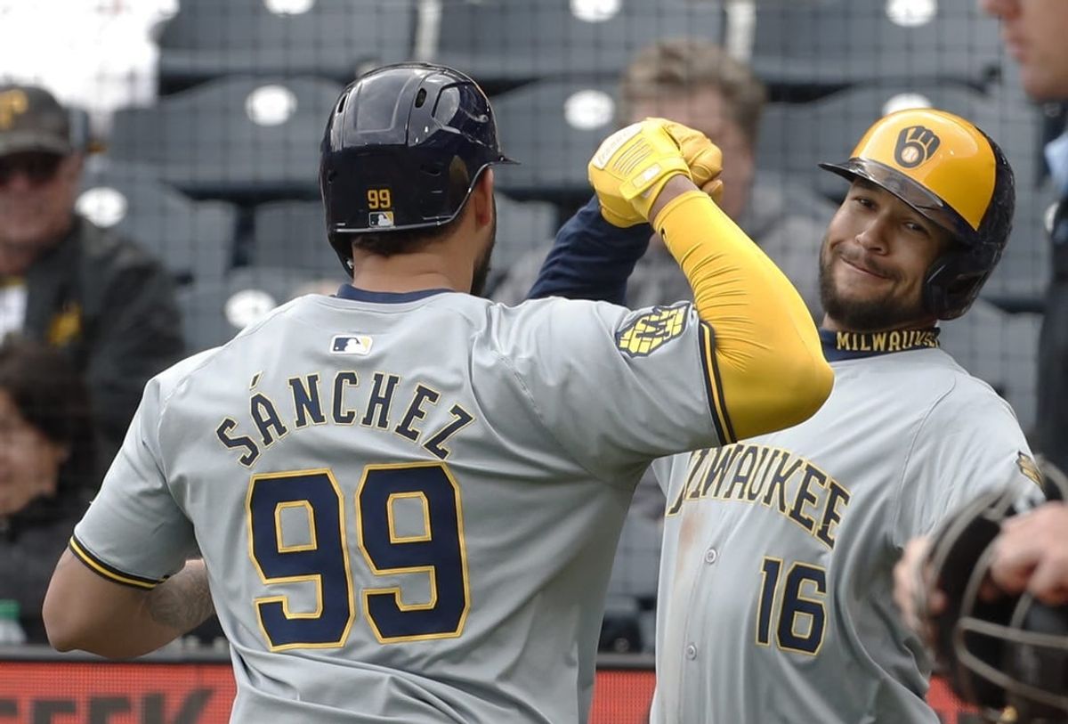 Apr 25, 2024; Pittsburgh, Pennsylvania, USA;  Milwaukee Brewers pinch hitter Gary Sánchez (99) celebrates his two run home run with center fielder Blake Perkins (16) against the Pittsburgh Pirates during the eighth inning at PNC Park. The Brewers won 7-5.
