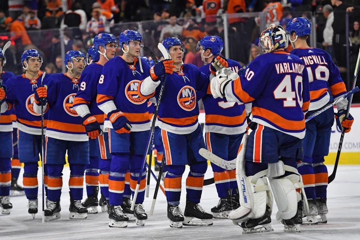 Apr 1, 2024; Philadelphia, Pennsylvania, USA; New York Islanders center Casey Cizikas (53) and goaltender Semyon Varlamov (40) celebrate win in overtime against the Philadelphia Flyers at Wells Fargo Center.