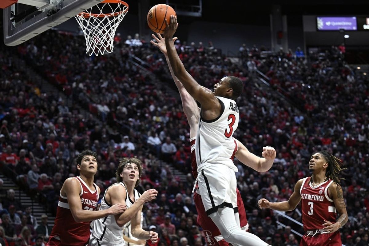 Dec 21, 2023; San Diego, California, USA; San Diego State Aztecs guard Micah Parrish (3) goes to the basket against the Stanford Cardinal during the first half at Viejas Arena.