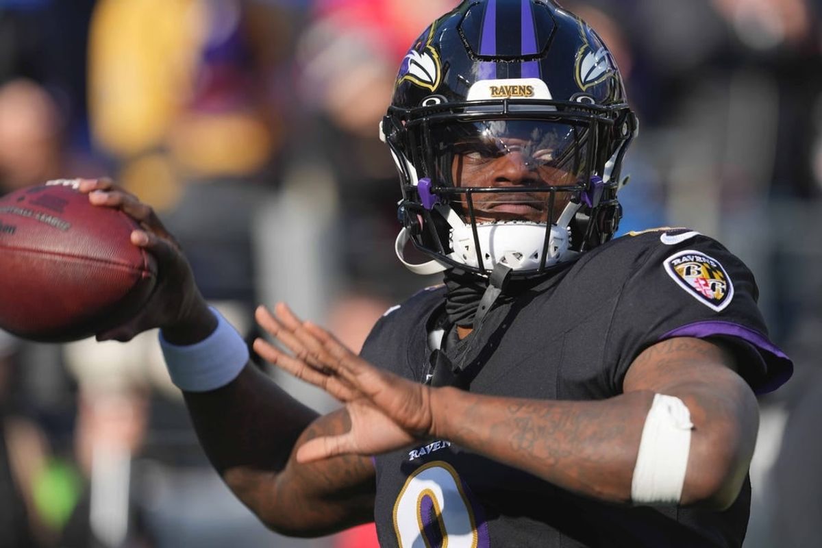 Dec 31, 2023; Baltimore, Maryland, USA; Baltimore Ravens  quarterback Lamar Jackson (8) warms up prior to the game against the Miami Dolphins at M&T Bank Stadium.