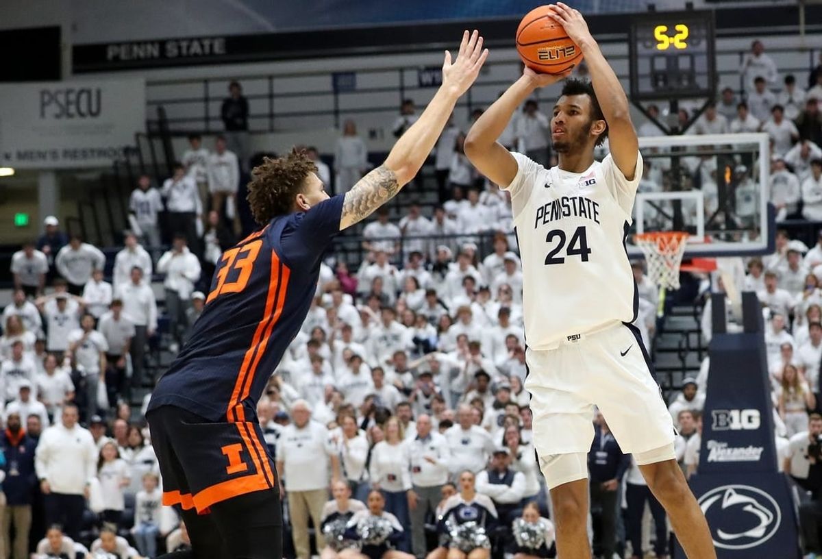 Feb 21, 2024; University Park, Pennsylvania, USA; Penn State Nittany Lions forward Zach Hicks (24) shoots before being fouled by Illinois Fighting Illini forward Coleman Hawkins (33) during the second half at Rec Hall. Penn State defeated Illinois 90-89.
