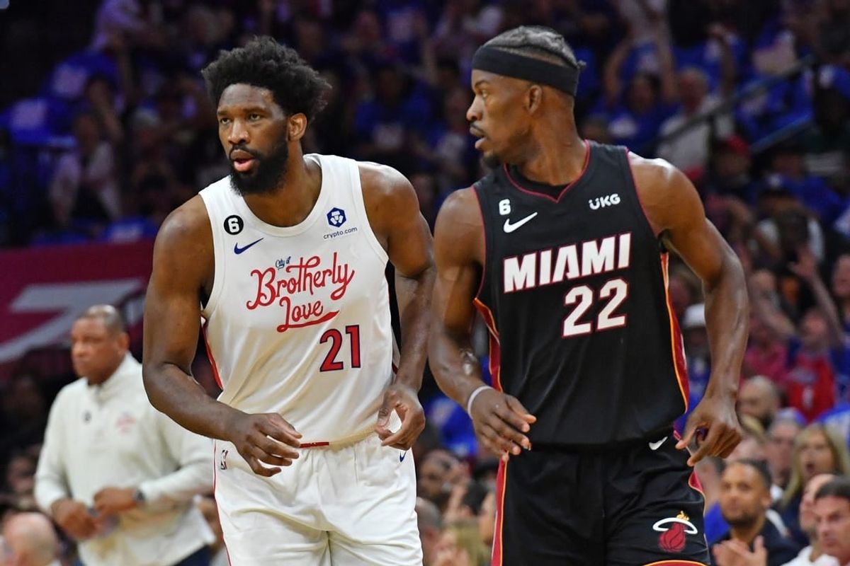 Apr 6, 2023; Philadelphia, Pennsylvania, USA; Philadelphia 76ers center Joel Embiid (21) and Miami Heat forward Jimmy Butler (22) during the first quarter at Wells Fargo Center.