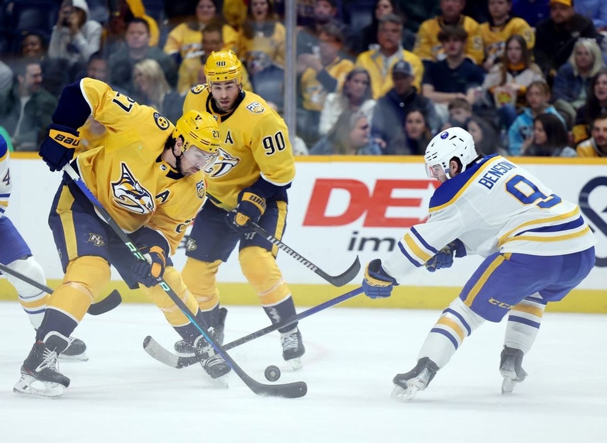 Mar 7, 2024; Nashville, Tennessee, USA; Nashville Predators defenseman Ryan McDonagh (27) breaks up an attack by Buffalo Sabres left wing Zach Benson (9) during their game at Bridgestone Arena.