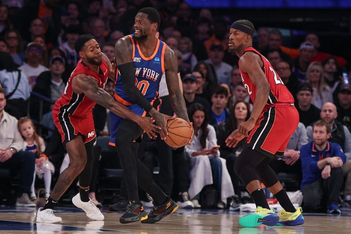 Jan 27, 2024; New York, New York, USA; New York Knicks forward Julius Randle (30) looks to pass as Miami Heat forward Haywood Highsmith (24) and forward Jimmy Butler (22) defend during the first half at Madison Square Garden.
