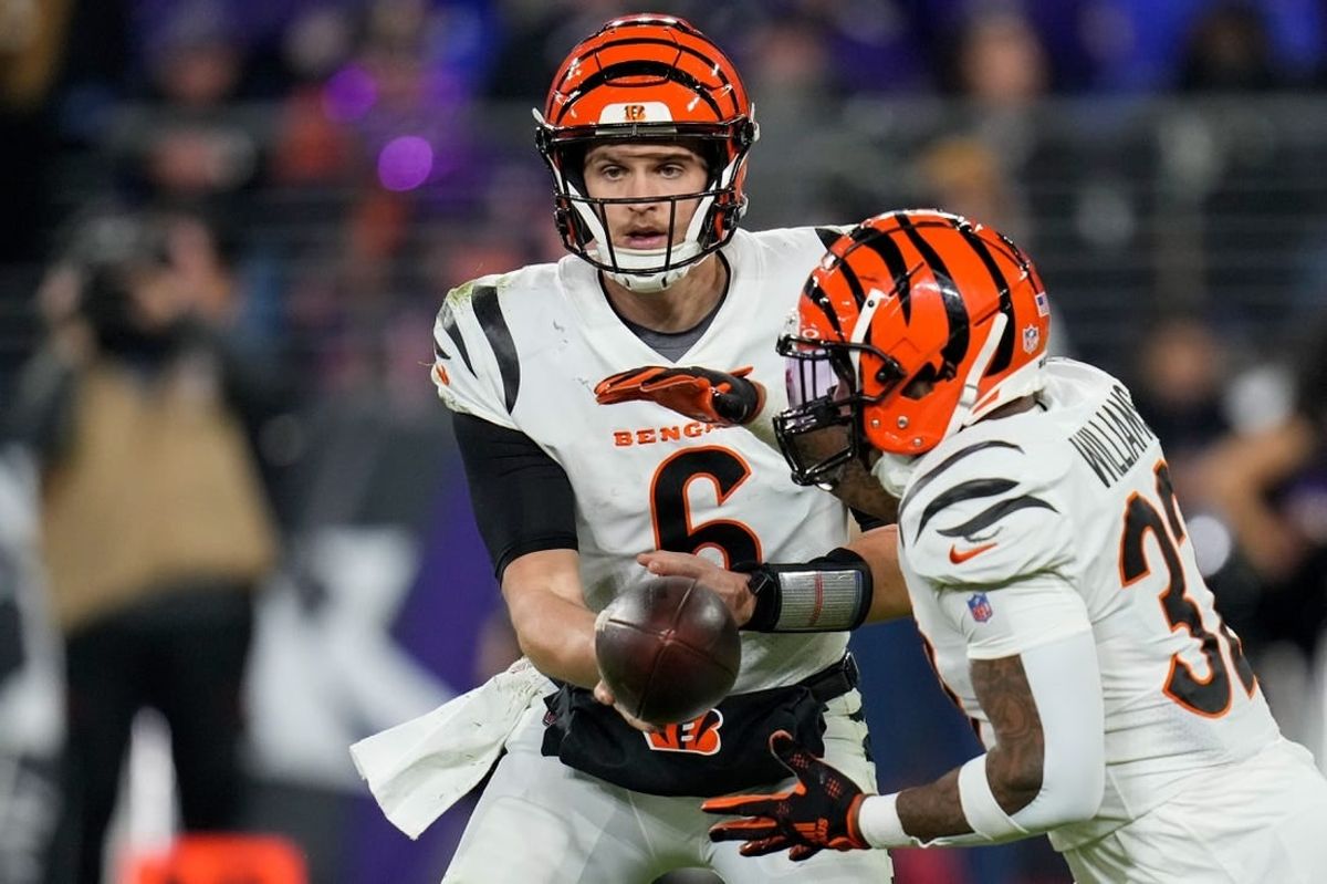 Nov 16, 2023; Baltimore, Maryland, USA; Cincinnati Bengals quarterback Jake Browning (6) hands off to running back Trayveon Williams (32) in the fourth quarter against the Baltimore Ravens at M&T Bank Stadium.