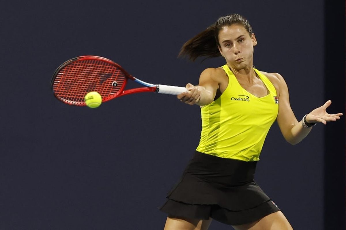 Mar 25, 2024; Miami Gardens, FL, USA; Emma Navarro (USA) hits a forehand against Jessica Pegula (USA) (not pictured) on day eight of the Miami Open at Hard Rock Stadium.