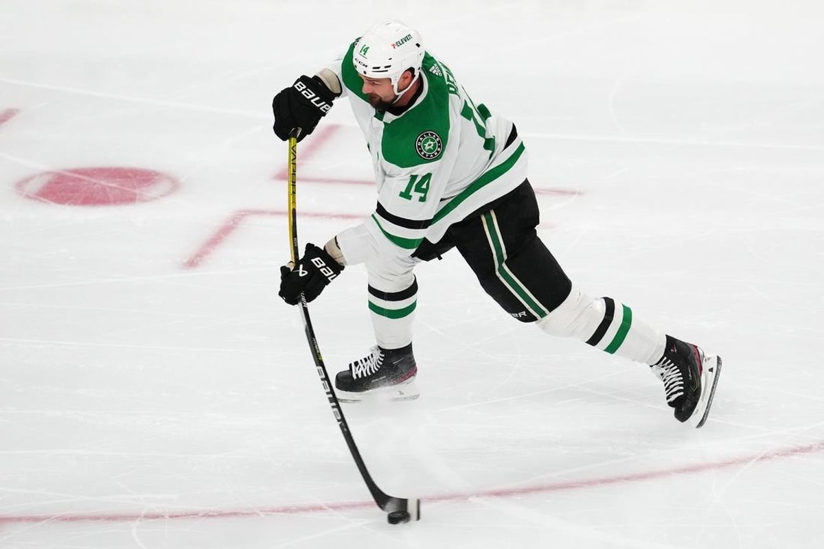 Apr 29, 2024; Las Vegas, Nevada, USA; Dallas Stars left wing Jamie Benn (14) shoots against the Vegas Golden Knights during the third period of game four of the first round of the 2024 Stanley Cup Playoffs at T-Mobile Arena.