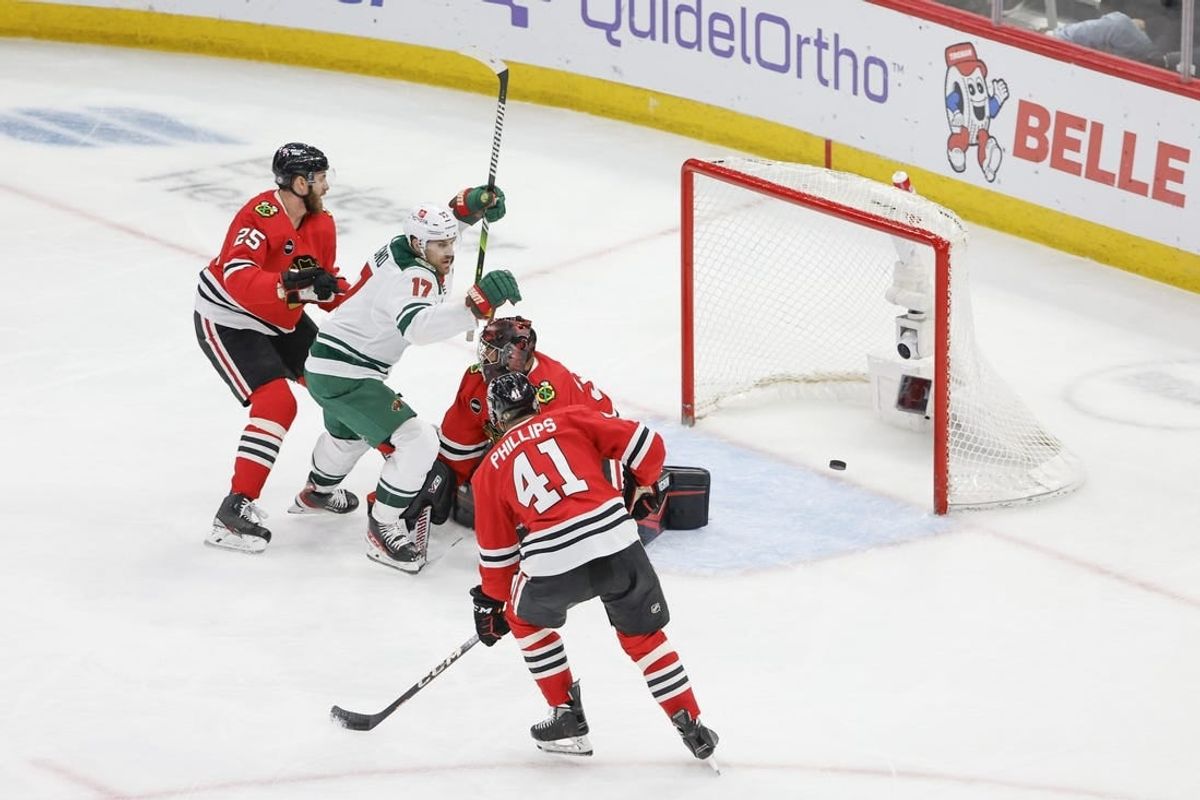 Feb 7, 2024; Chicago, Illinois, USA; Minnesota Wild left wing Marcus Foligno (17) celebrates after scoring against Chicago Blackhawks goaltender Petr Mrazek (34) during the third period at United Center.