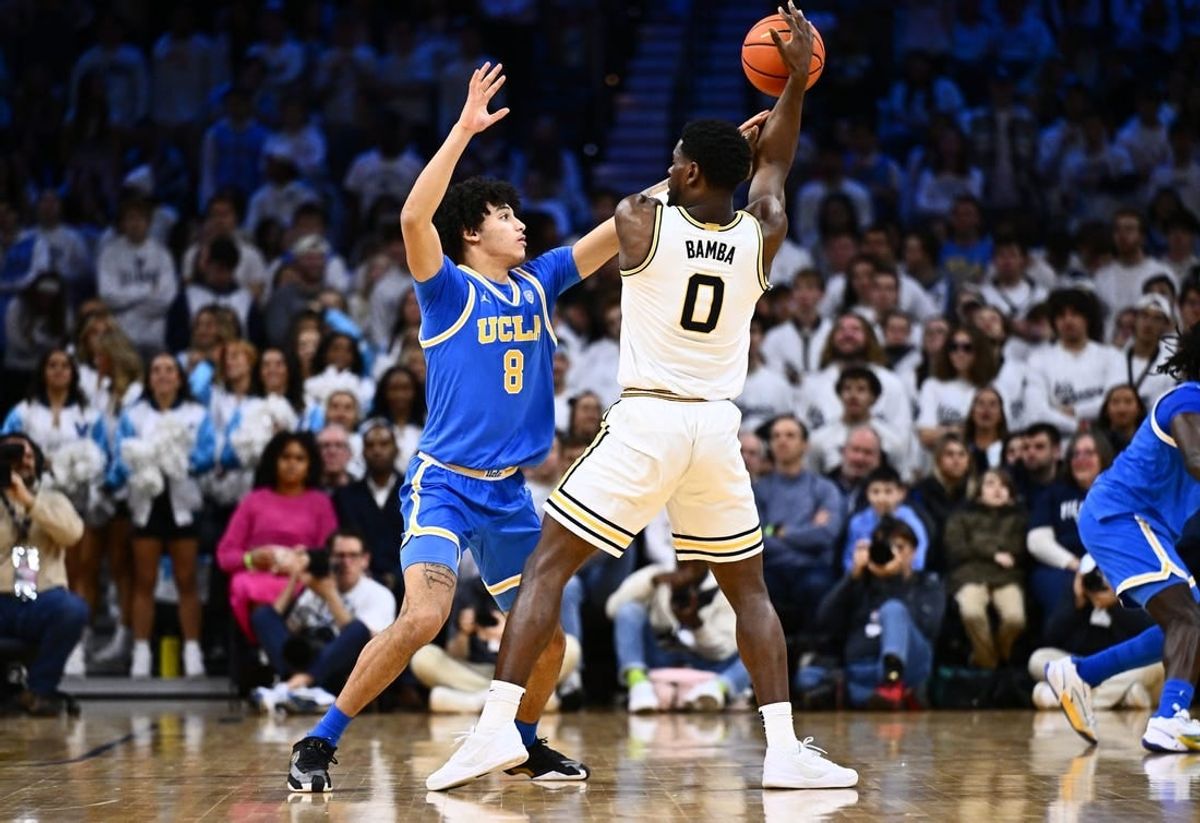 Dec 9, 2023; Philadelphia, Pennsylvania, USA; UCLA Bruins guard Ilane Fibleuil (8) defends Villanova Wildcats guard TJ Bamba (0) in the first half at Wells Fargo Center.