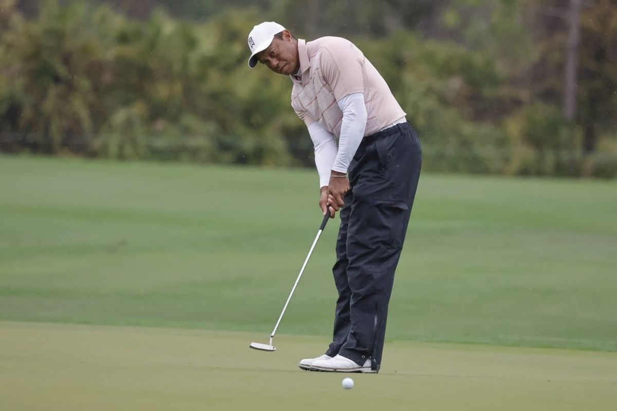 Dec 16, 2023; Orlando, Florida, USA; Tiger Woods putts on the fifth green during the PNC Championship at The Ritz-Carlton Golf Club.