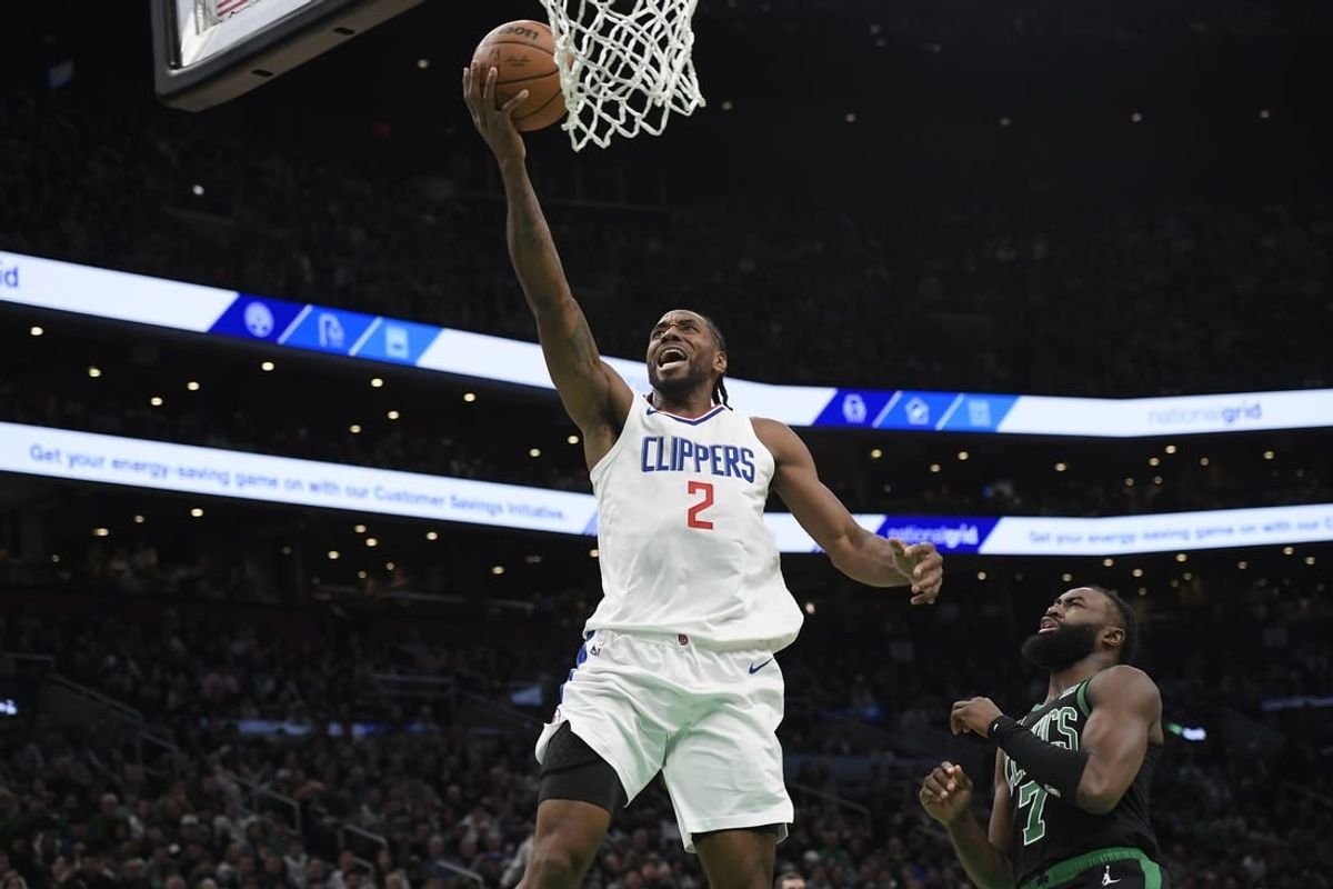 Jan 27, 2024; Boston, Massachusetts, USA;  LA Clippers forward Kawhi Leonard (2) lays the ball in the basket during the first half against the Boston Celtics at TD Garden.