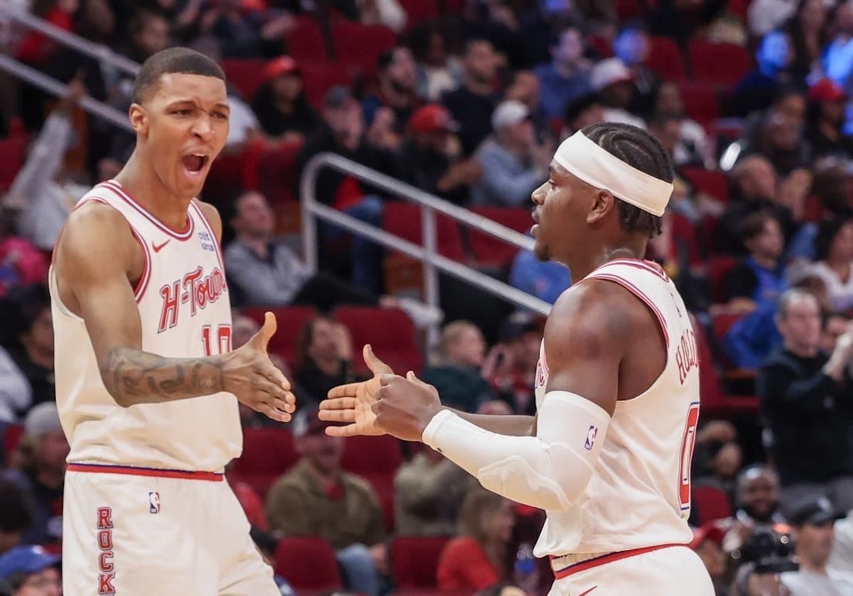 Dec 6, 2023; Houston, Texas, USA;  Houston Rockets forward Jabari Smith Jr. (10) reacts a basket by guard Aaron Holiday (0) against the Oklahoma City Thunder in the second half at Toyota Center.