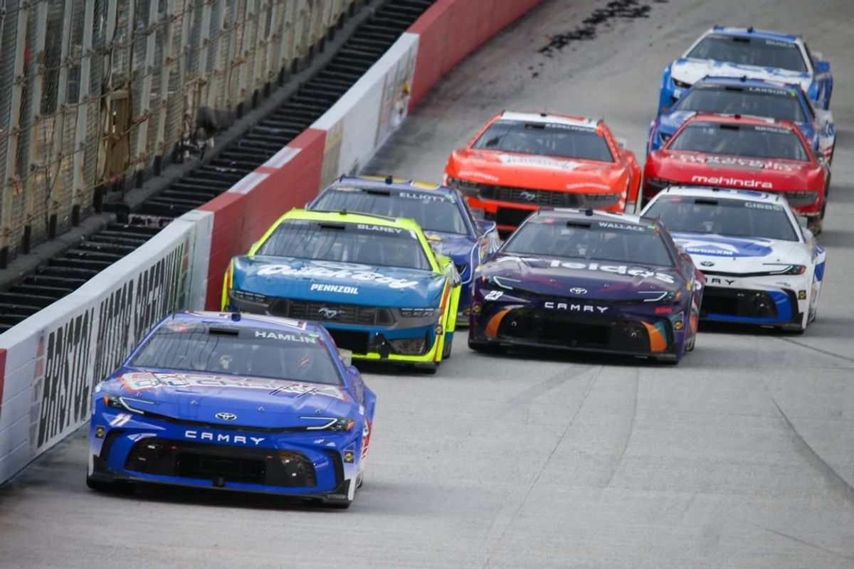 Mar 16, 2024; Bristol, Tennessee, USA; NASCAR Cup Series driver Denny Hamlin (11) leads driver Ryan Blaney (12) during the Food City 500 at Bristol Motor Speedway.