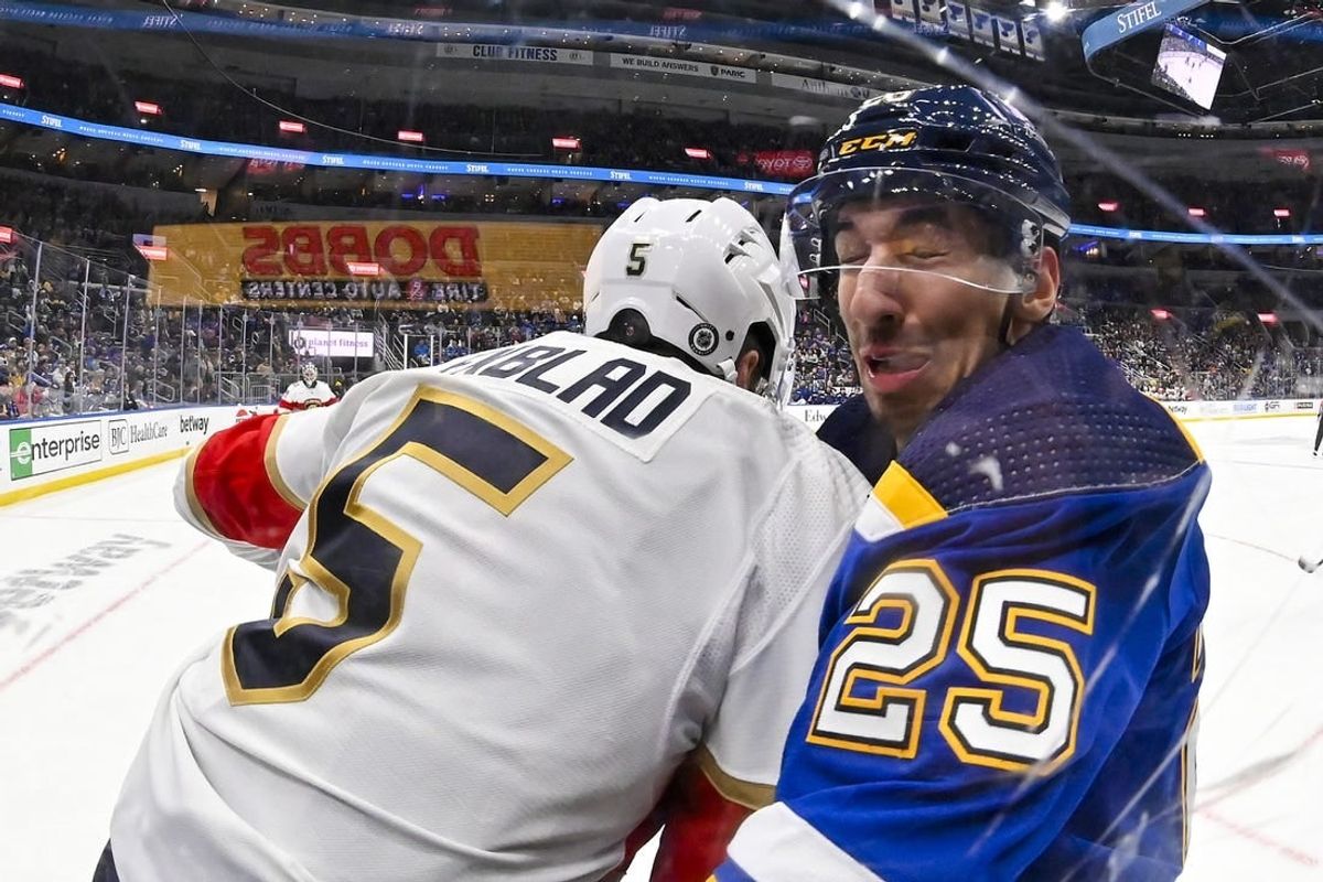 Jan 9, 2024; St. Louis, Missouri, USA;  Florida Panthers defenseman Aaron Ekblad (5) checks St. Louis Blues center Jordan Kyrou (25) during the second period at Enterprise Center.