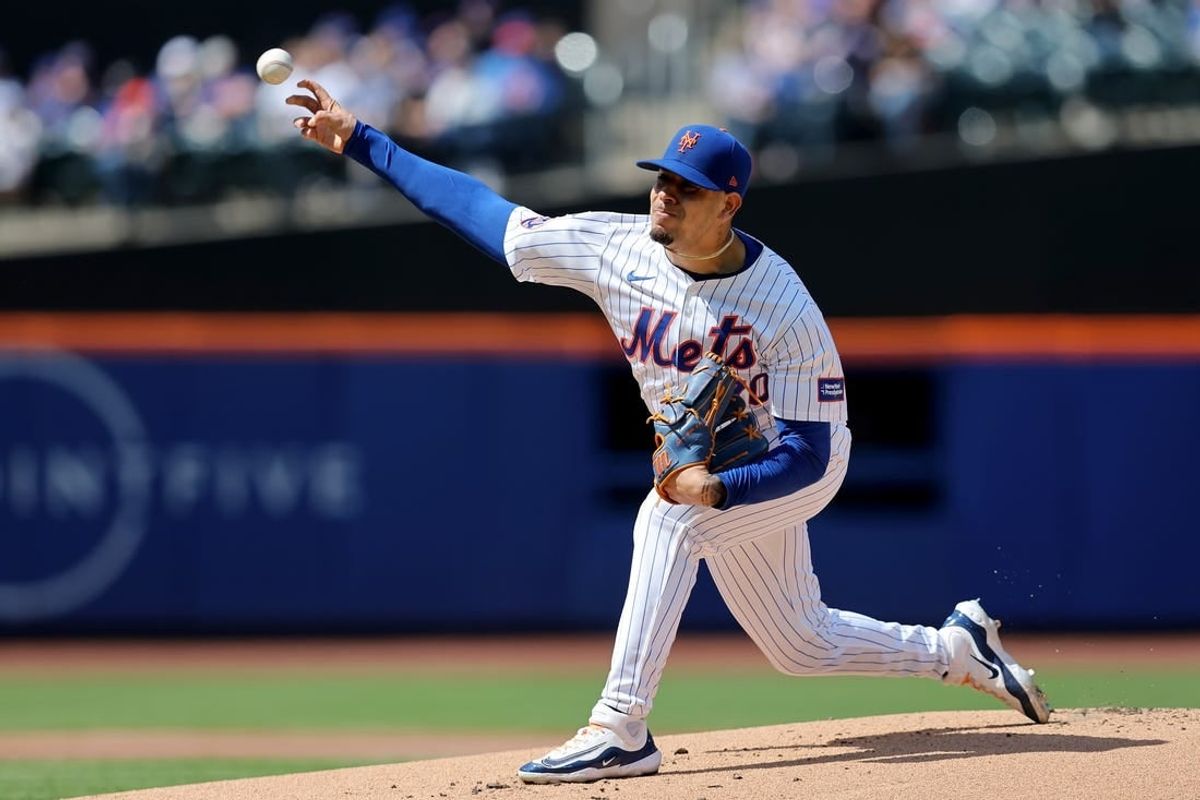 Apr 14, 2024; New York City, New York, USA; New York Mets starting pitcher Jose Butto (70) pitches against the Kansas City Royals during the first inning at Citi Field.